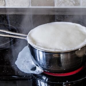 boiling over of milk, ceramic hob, hotplate, pot, milk, foaming milk, branded milk, annoying, to forget, dementia, forgetfulness, reflection, odor, milk splash, steam, boiling milk, hot, milk, milk, milk, milk, milk, boiling milk, boiling milk, boiling milk